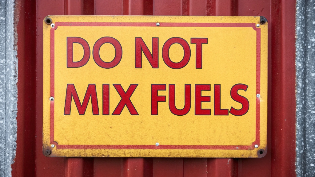A warning sign showing 'Do Not Mix Fuels'